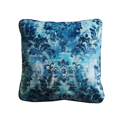 Decorative blue floral cushion cover with piped edge on a white background