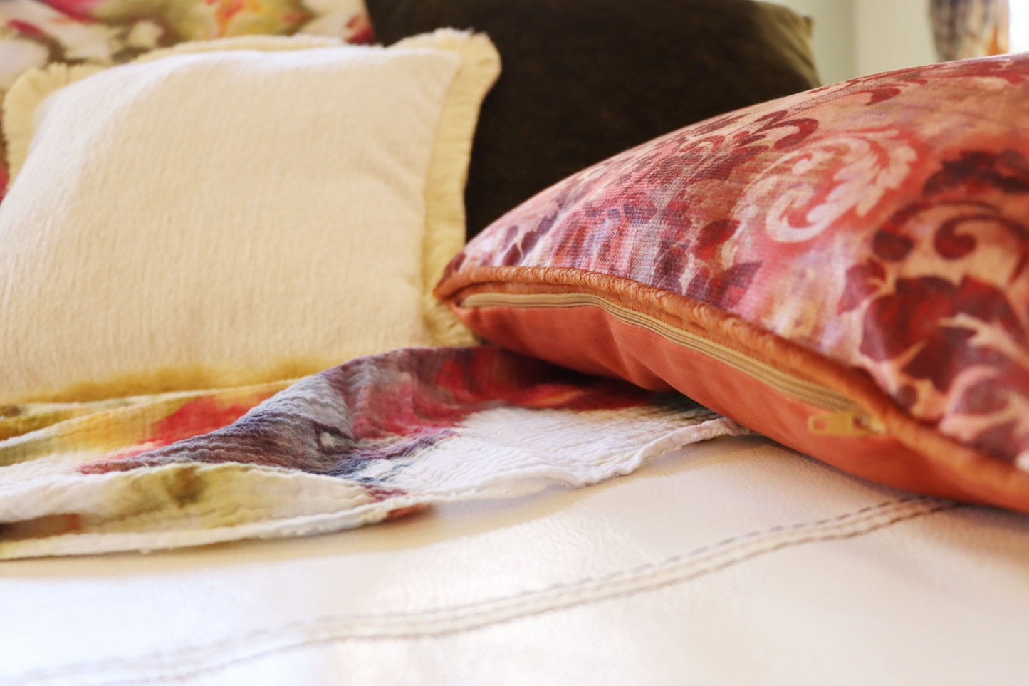 floral cushion cover with piped edge on a sofa with a floral pattern
