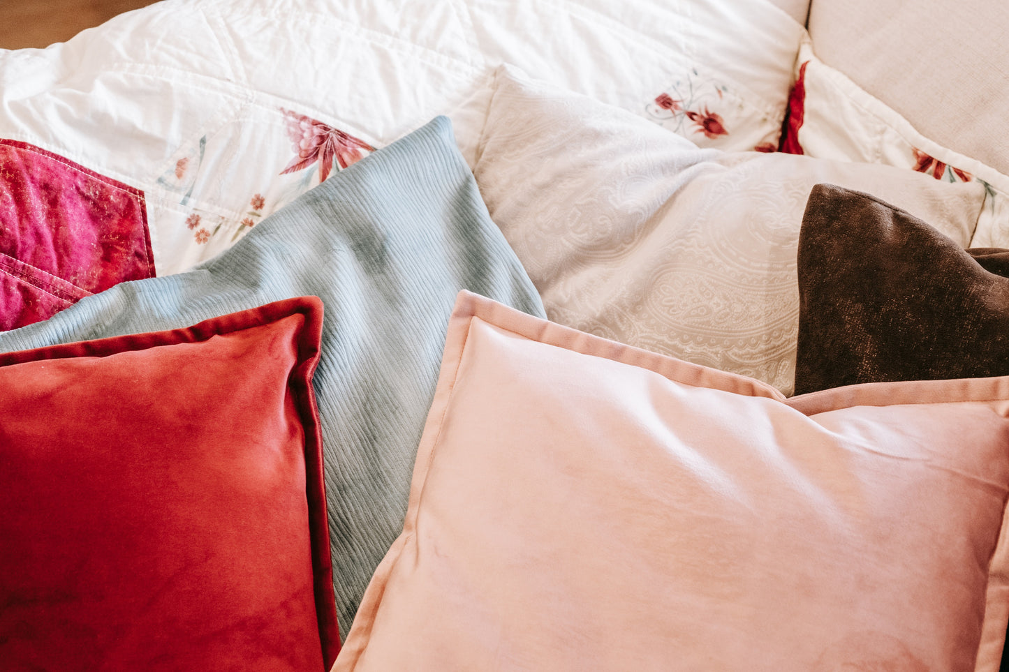 Lifestyle photo of textured velvet cushion cover on couch