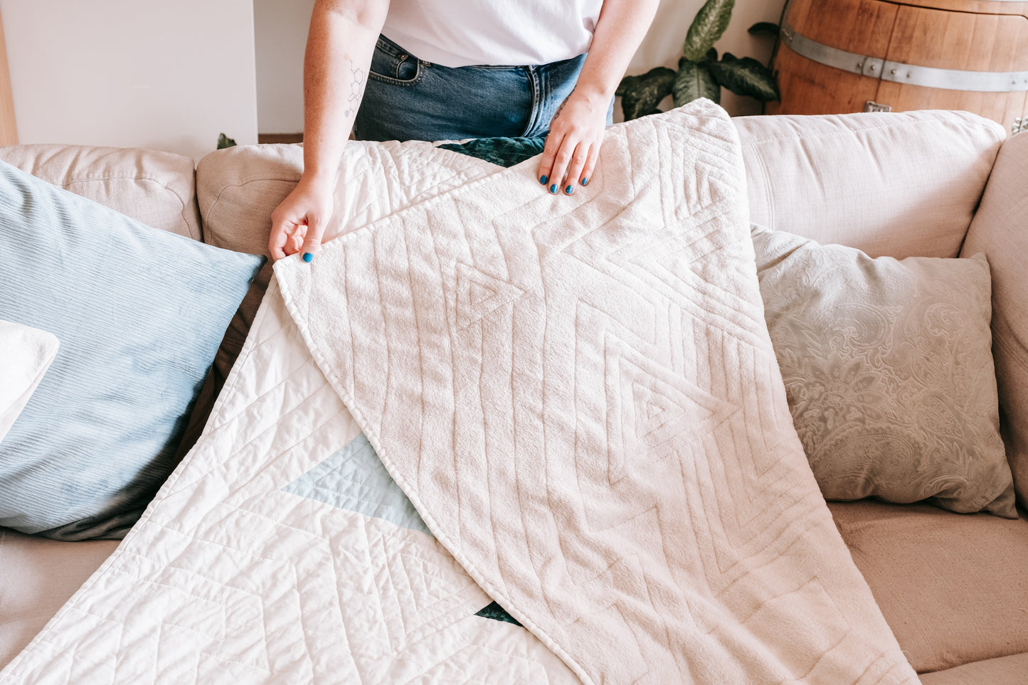 Lifestyle photo of textured velvet cushion cover on couch