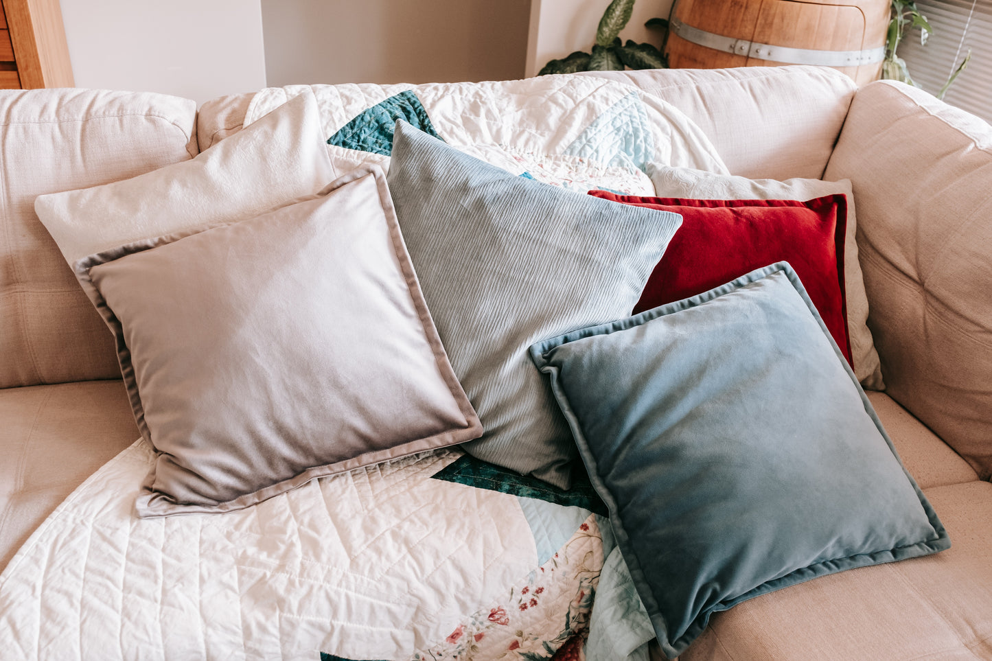 Lifestyle photo of velvet cushion covers on couch