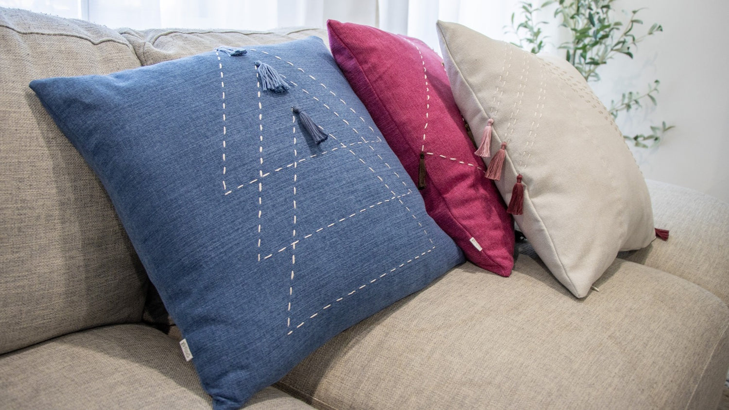 cushion cover with embroidery and tassels