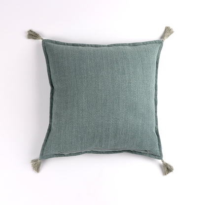 Back of light green handmade cushion cover with tassels