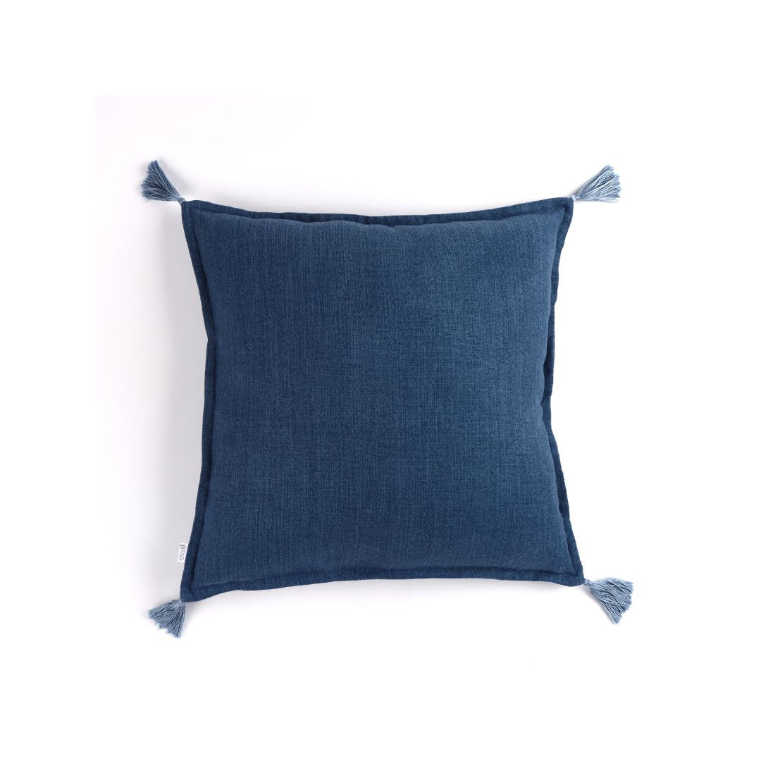 Front of dark blue handmade cushion cover with tassels