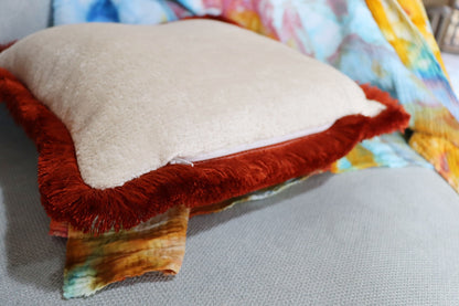 Zipper of chenille cushion cover with cotton fringe on a sofa
