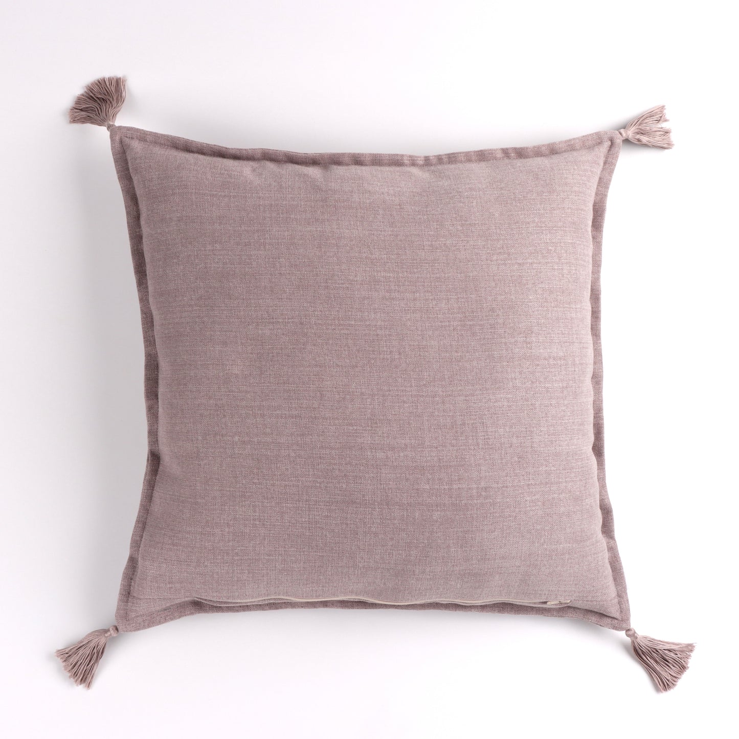 Back of pale pink handmade cushion cover with tassels