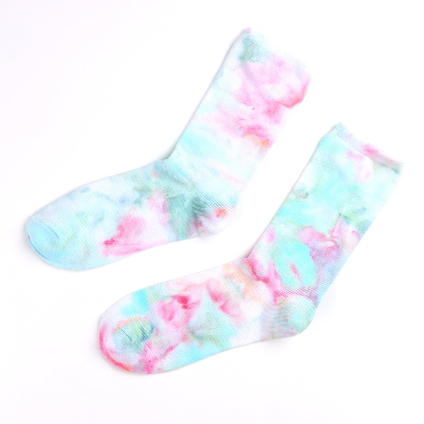 Flat lay of light blue and pink Ice-dyed bamboo socks