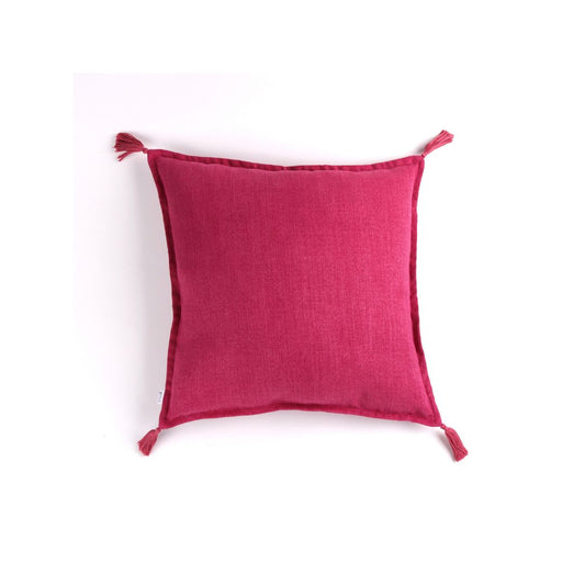 Front of bright pink handmade cushion cover with tassels