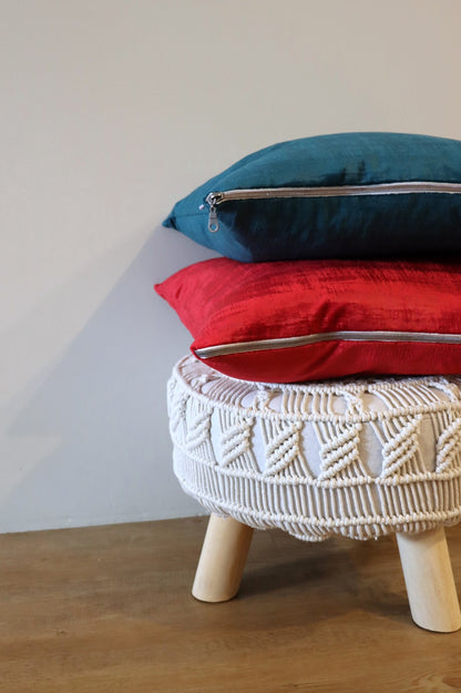 Stack of handmade textured velvet cushion cover with exposed zipper