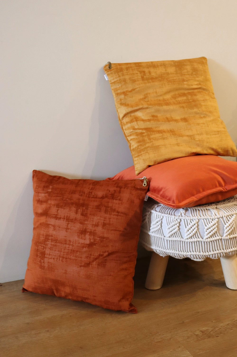 Lifestyle photo of ochre handmade textured velvet cushion cover with exposed zipper