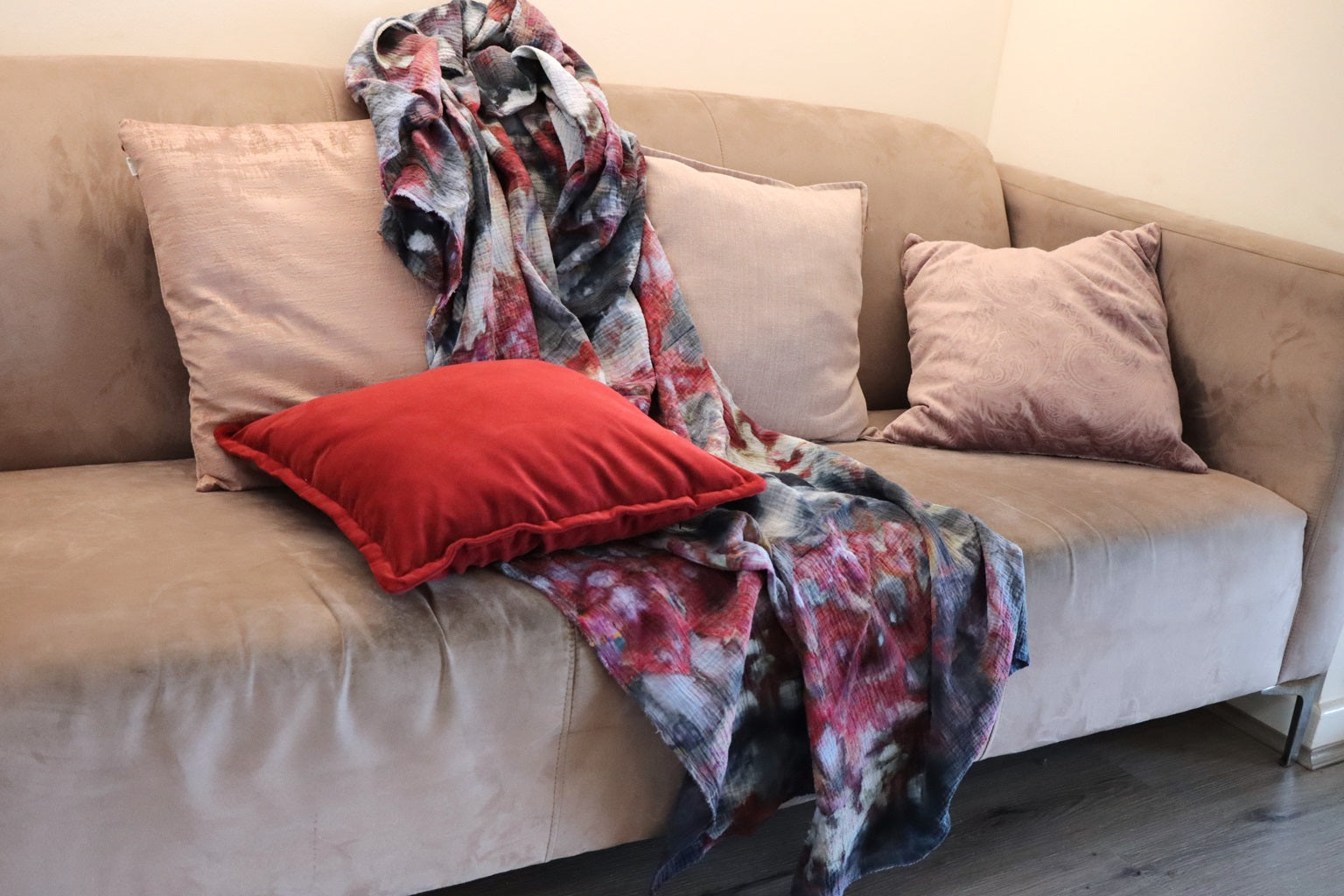 Lifestyle photo of handmade ice-dyed cotton throw