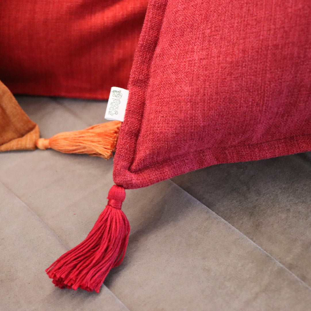 Close up of tassel of handmade cushion cover with tassels