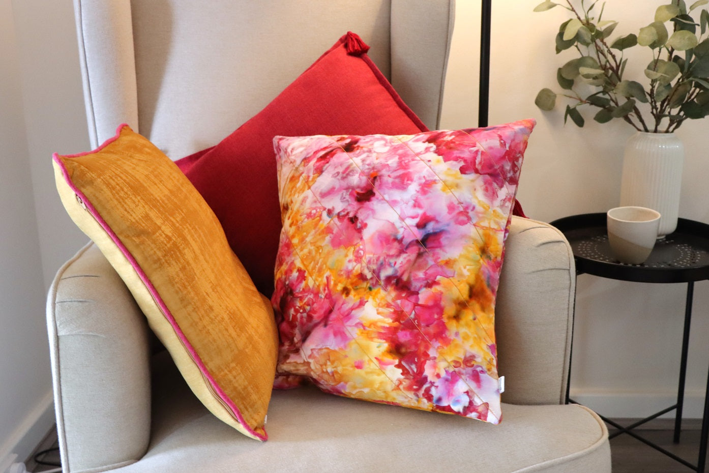 Lifestyle photo of yellow and pink  Velvet Cushion Cover with Contrasting Piping on chair