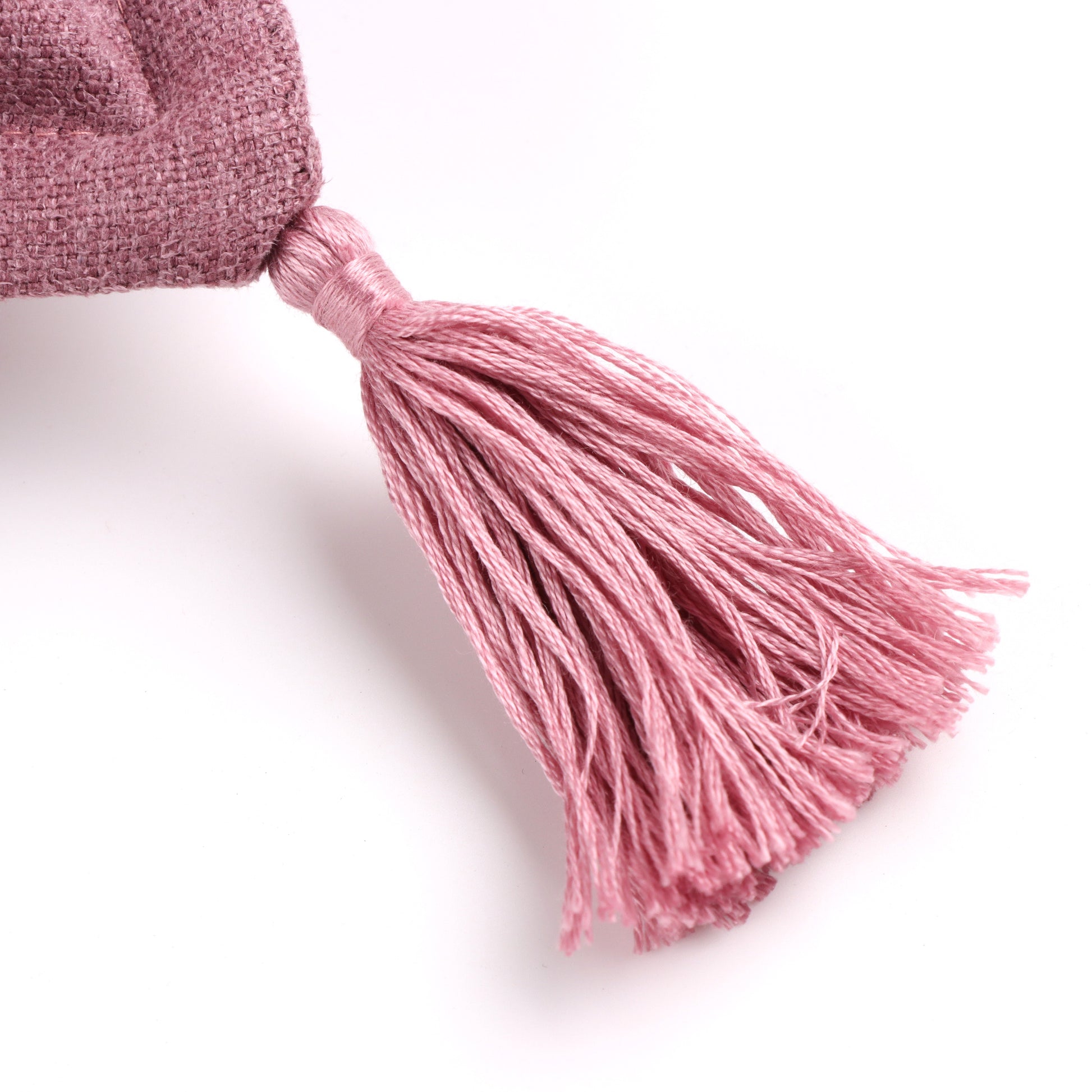 Close up of tassel from handmade cushion cover with tassels