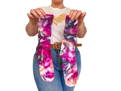 Person holding crew length Ice-dyed bamboo socks