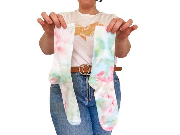 Person holding crew length Ice-dyed bamboo socks