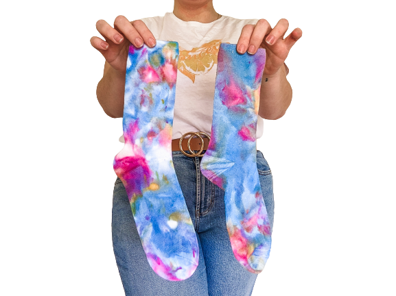 Person holding crew length Ice-dyed bamboo socks