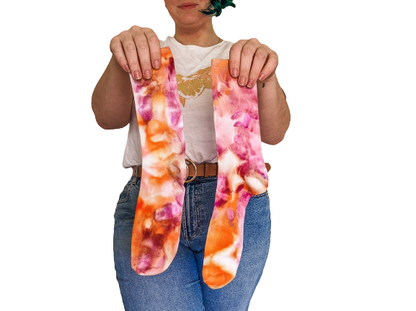 Person holding crew length Ice-dyed bamboo socks