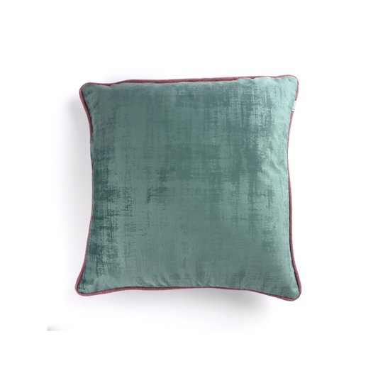 Front of light green velvet cushion cover with contrasting piping