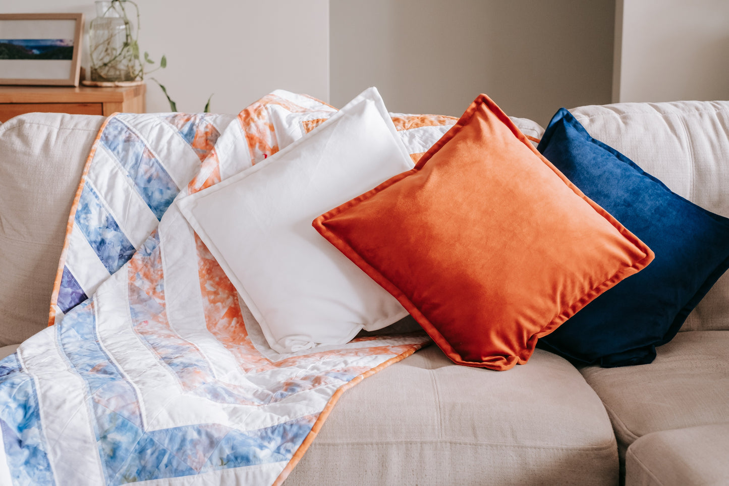 handmade quilt with mink backing and velvet cushions on couch