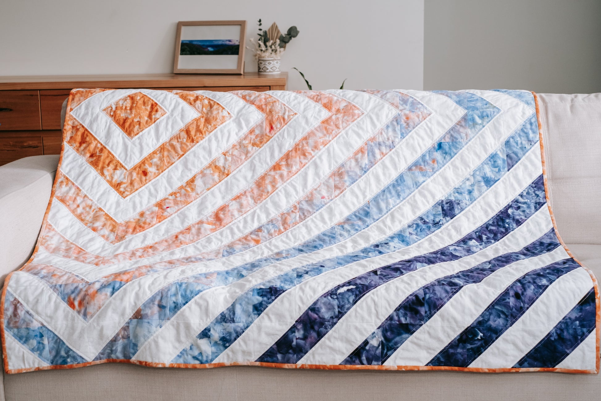 Blue and orange diamond geometric handmade quilt with mink backing