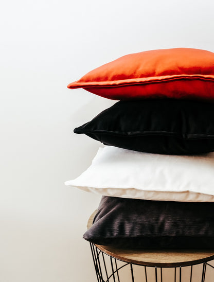 Stack of textured velvet cushion cover