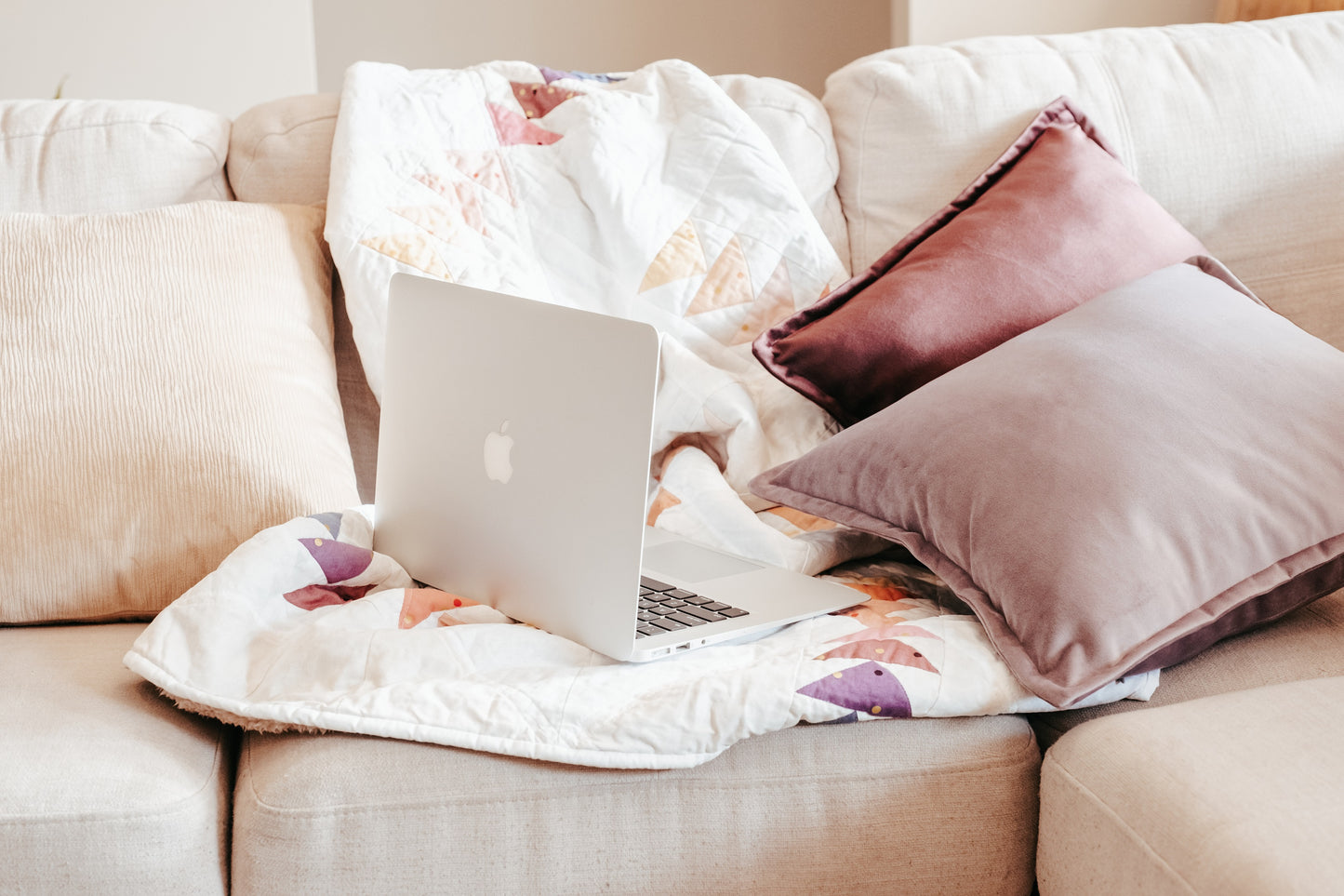 Lifestyle photo of velvet cushion cover with flange edging on couch