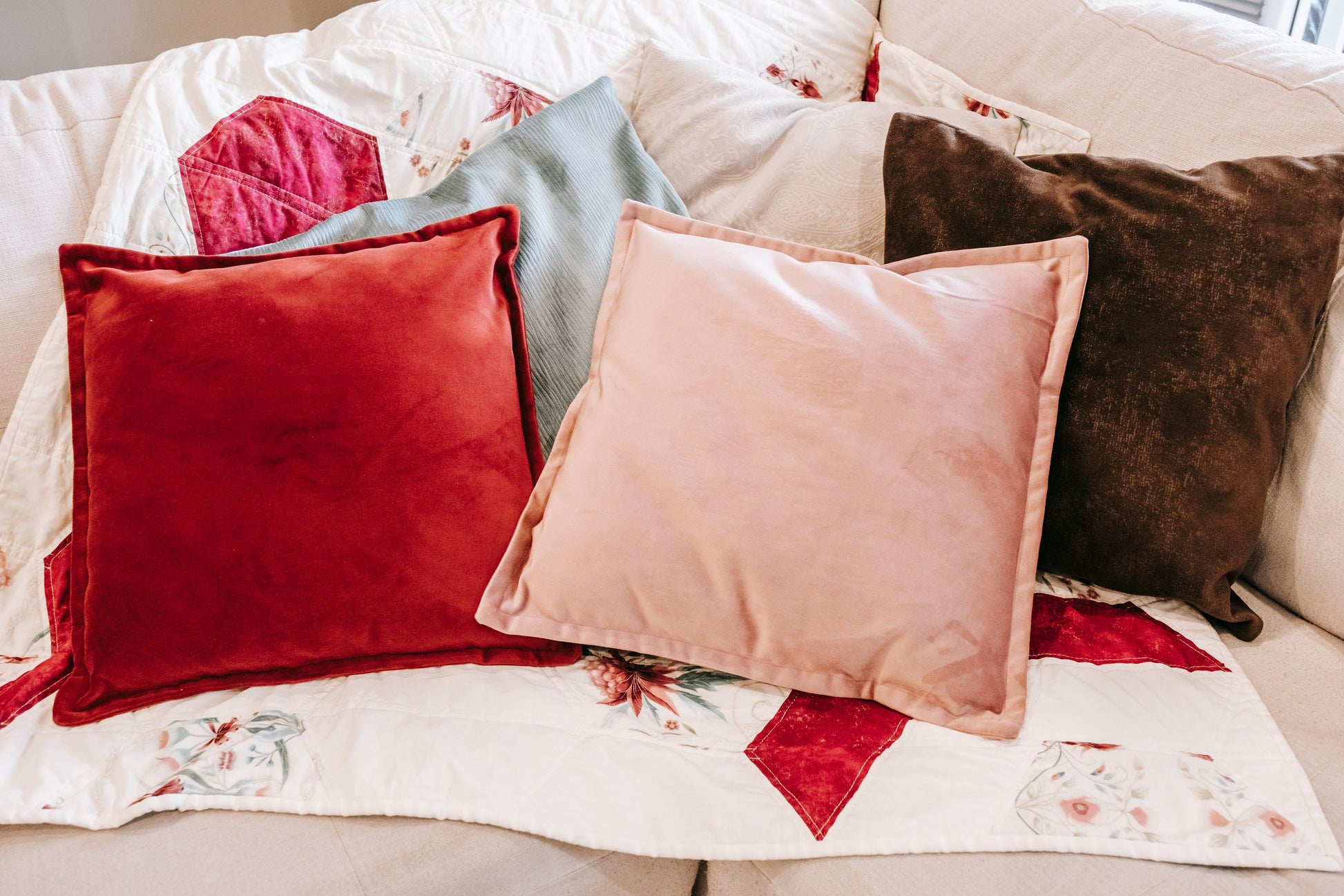 Lifestyle photo of textured velvet cushion cover on couch