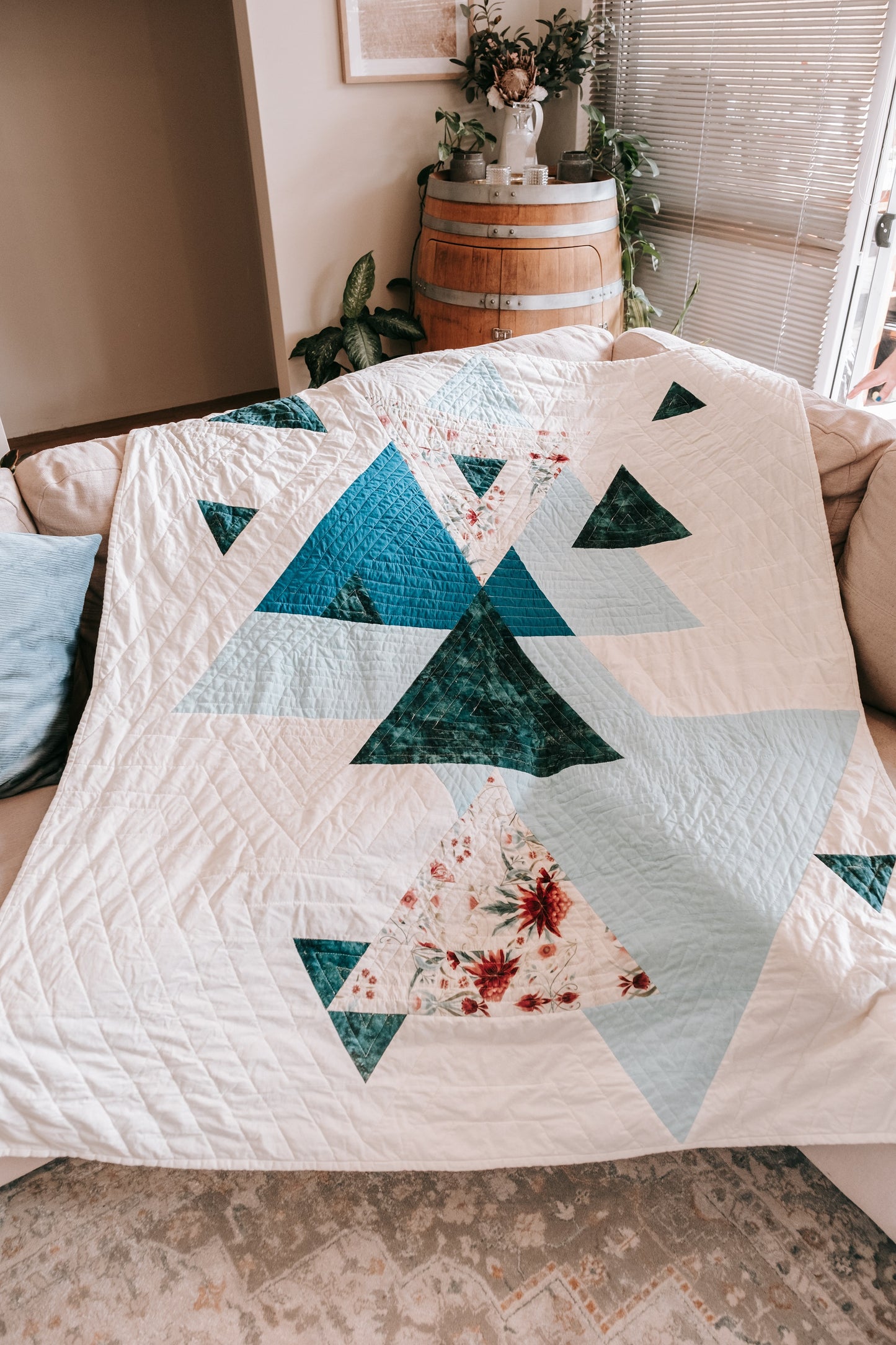 Photo of triangle handmade quilt with mink backing