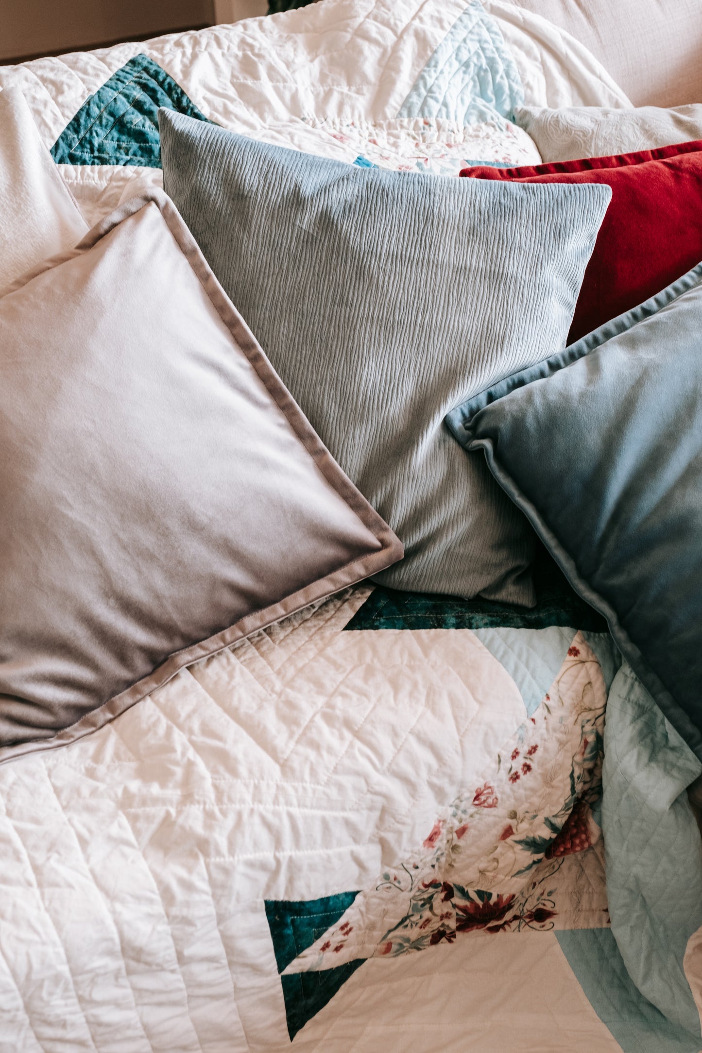 Lifestyle photo of velvet cushion cover with flange edging on couch