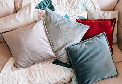 Lifestyle photo of textured velvet cushion cover on sofa