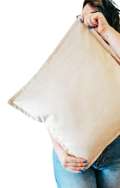 Person holding light brown velvet cushion cover with flange