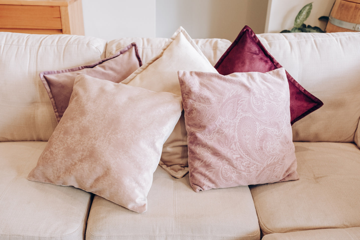 Lifestyle photo of textured velvet cushion cover on couch