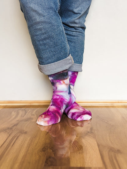 Person wearing crew length purple and black Ice-dyed bamboo socks