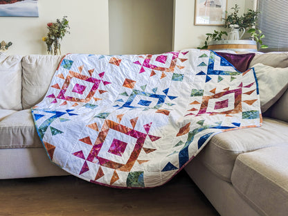 diamond handmade boho quilt with mink backing on couch