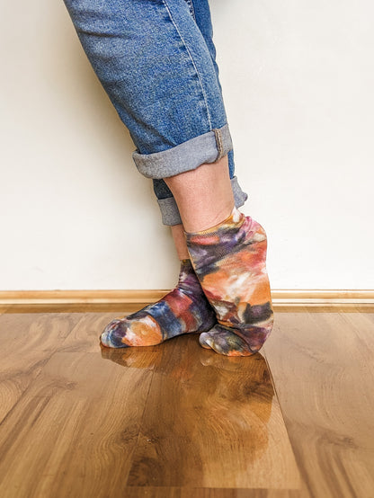 Person wearing black and brown Ice-dyed bamboo socks