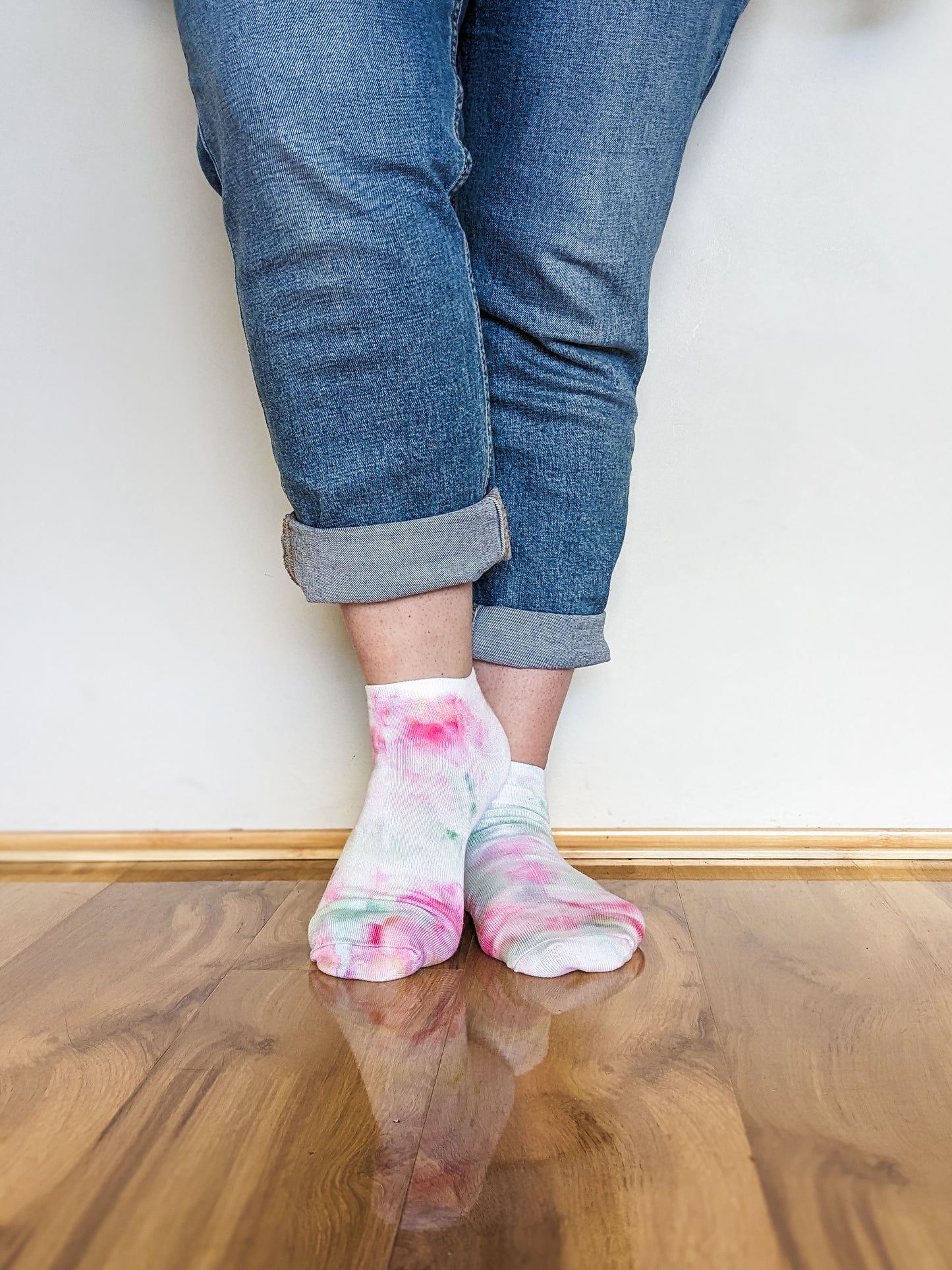 Person wearing light pink and blue Ice-dyed bamboo socks