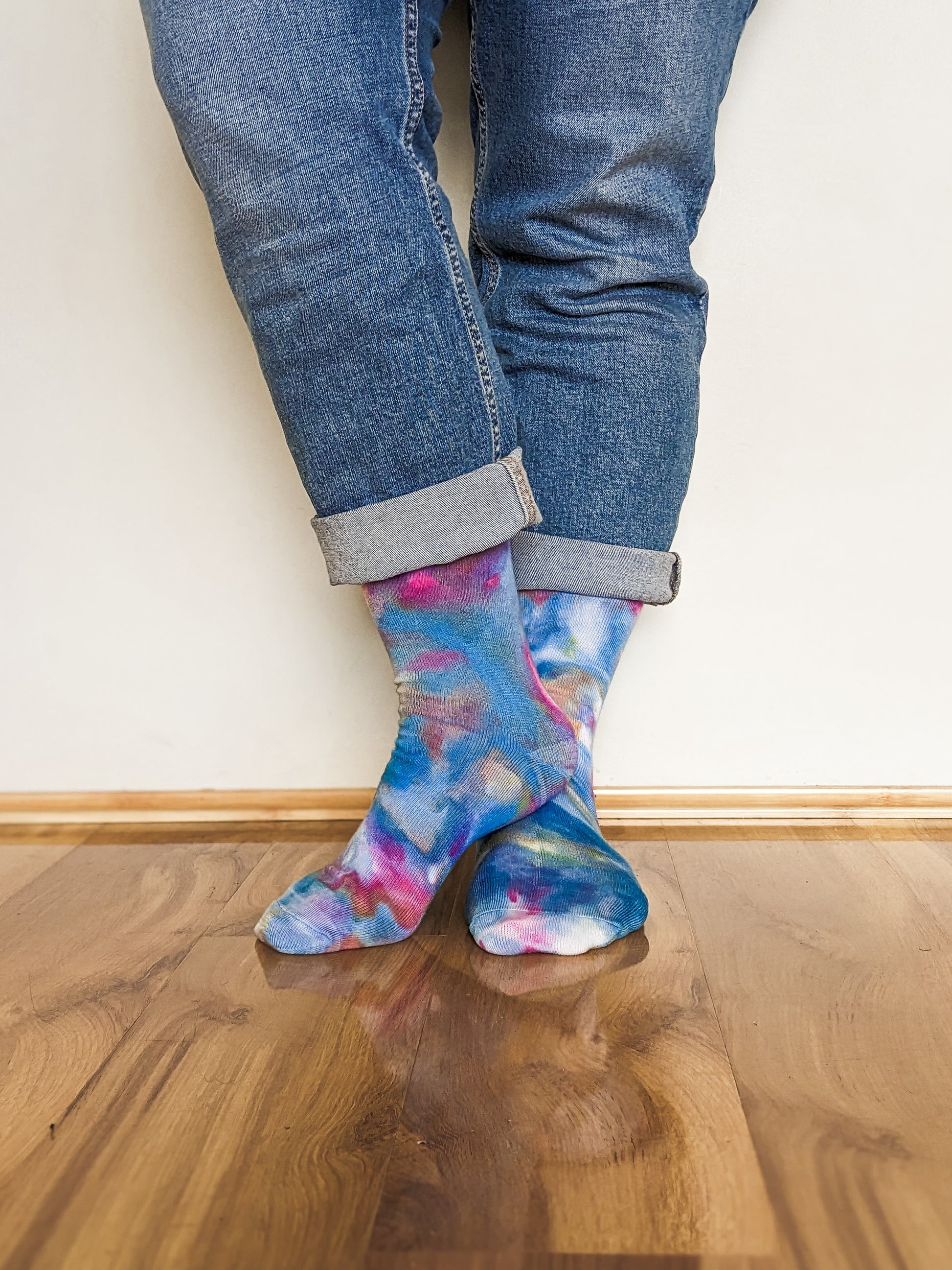 Person wearing blue and pink Ice-dyed bamboo socks