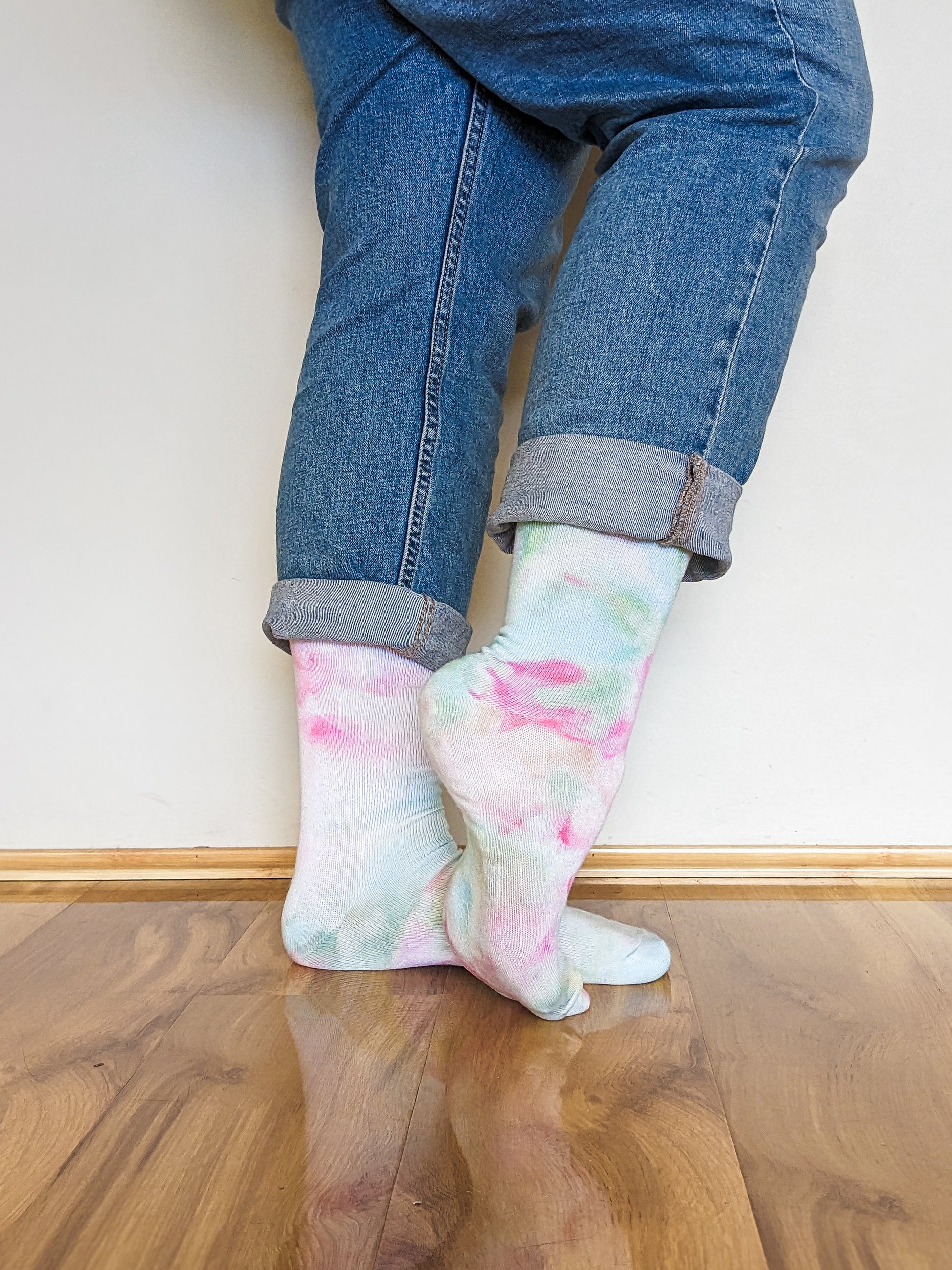 Person wearing light pink and blue Ice-dyed bamboo socks